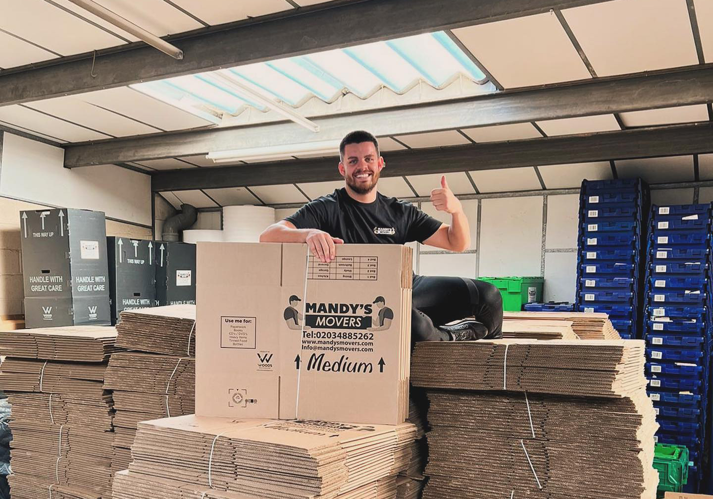 Man packaging storage boxes
